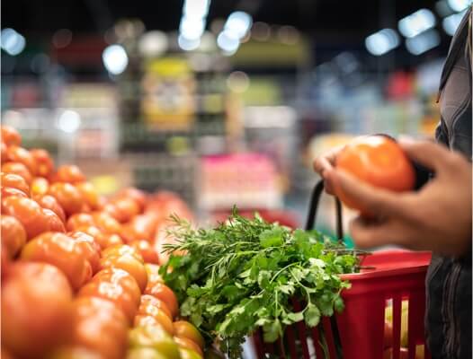 Image of Onions and Greens at Grocery Store